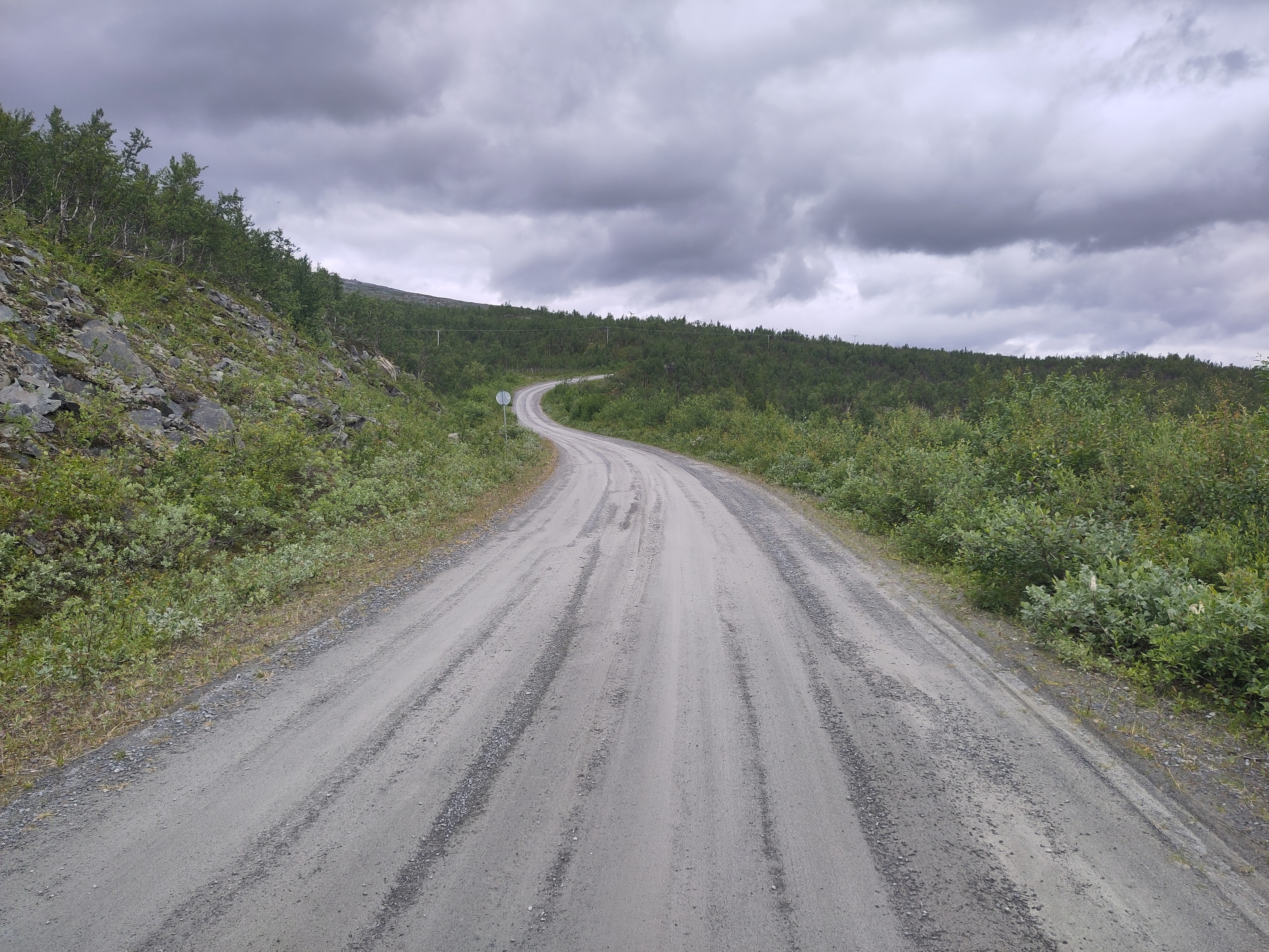 A gravel road leading up and away into the distance.